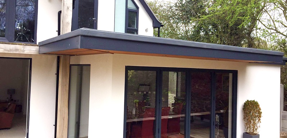 three sets of grey bi-fold doors with matching windows in nottingham